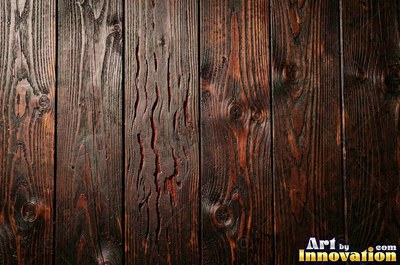 Rough sawn timber boards with faint saw marks under a dark walnut stain