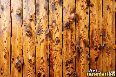 Wide boards in espresso brown stain with hairline checks and nail holes