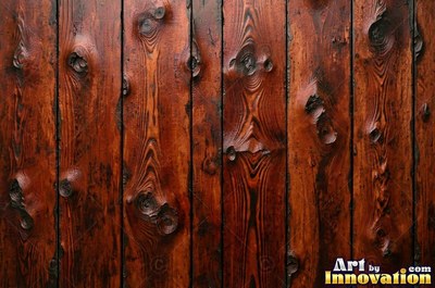 Vertical barn boards in oxblood red stain with every knot showing through