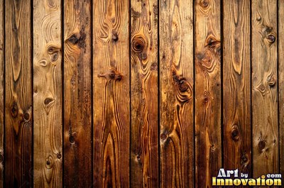 Tall vertical planks of old growth timber in a deep translucent stain