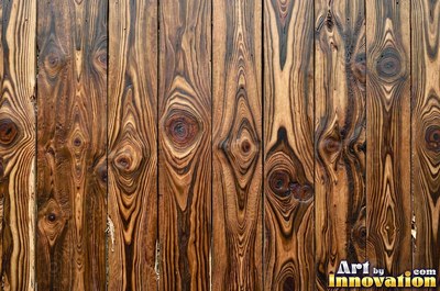 Wide boards in espresso brown stain with hairline checks and nail holes