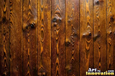Vertical barn boards in oxblood red stain with every knot showing through
