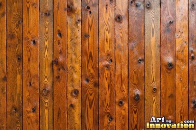 Tall vertical planks of old growth timber in a deep translucent stain