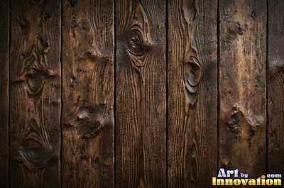 Rough sawn timber boards with faint saw marks under a dark walnut stain