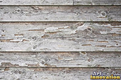 Silver gray barn siding filling the frame under soft even light