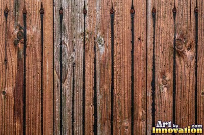 Silver gray barn siding filling the frame under soft even light