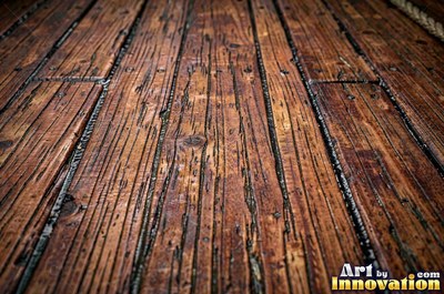 Rough hewn beams with axe marks and dark age cracks in cedar orange