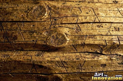 Rough hewn beams with axe marks and dark age cracks in cedar orange