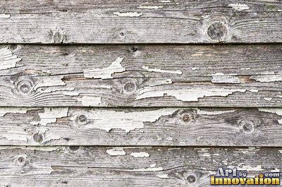 Silver gray barn siding filling the frame under soft even light