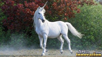 Trotting pure white unicorn turned three quarters forward in front of reddish bushes