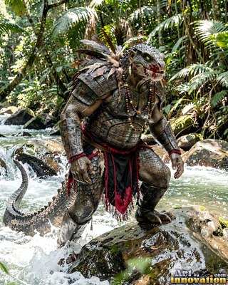 Wading in a jungle river, an armored crocodile warrior perches on a wet rock