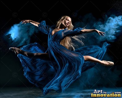 Leaping in a split, a blonde woman dances in a flowing blue dress through blue powder smoke
