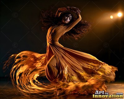 A woman twirls in a long gold dress with her curly hair flying under dim spotlights