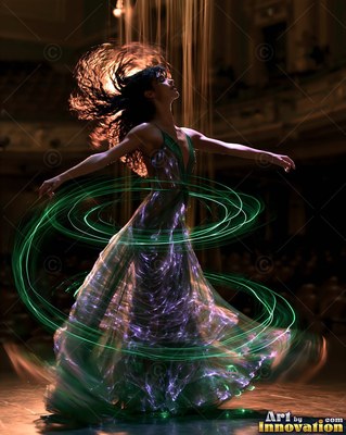 On a dark stage, a woman spins in a long dress looped in green traces of light