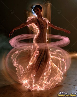 A woman in a long dress spins as pink trails of light swirl around her waist