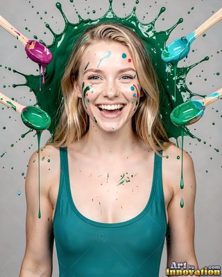 A smiling blonde woman in a teal swimsuit with green paint splashing behind her