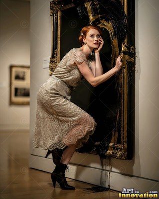 In a dim museum, a woman in a beaded dress walks out of a dark black frame