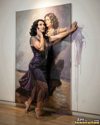 A woman in a purple dress moves out of a large canvas