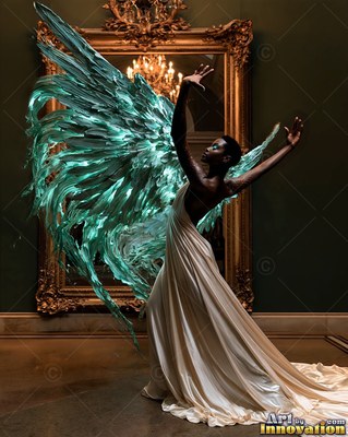 A woman in a cream dress poses with green glass wings near a mirror