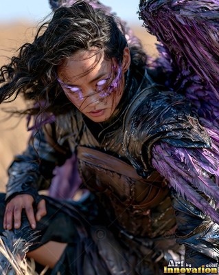 Crouching in an open field, a feathered woman in dark armor looks down