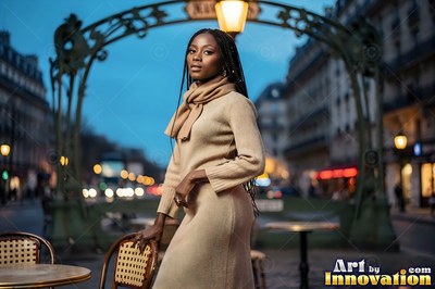 Wearing a beige knit dress and scarf, a woman stands by a Paris metro entrance at dusk