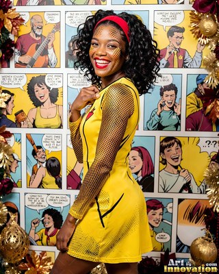 Before comic book panels, a smiling woman strikes a pose in a yellow superhero dress