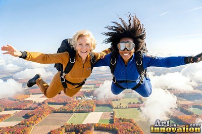 High above autumn fields, two women skydive in brown and blue suits