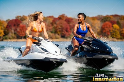 On a sunny lake, both women in swimwear smile while riding jet skis together