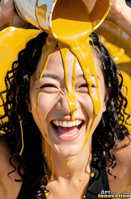 Dark curly hair frames a laughing woman outdoors as yellow paint pours over her head