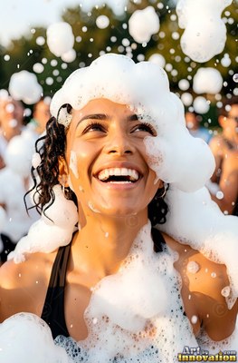 Tilted back outdoors, a smiling woman is covered in white foam