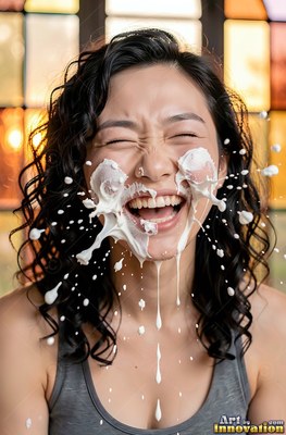 Facing forward by a colorful window, a giggling woman finds herself splashed with milk