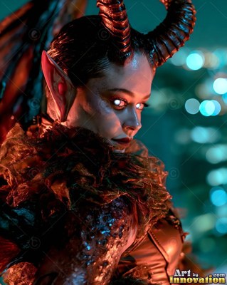 Before blurred city lights, a horned sharp-eared woman looks back over her shoulder
