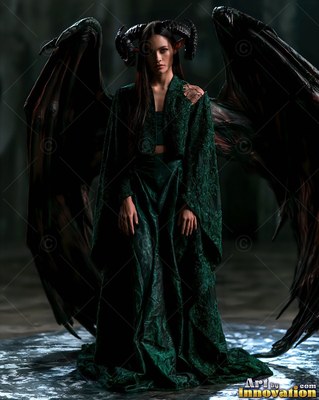 Standing straight in a dark room, a horned woman wears a green gown and wings