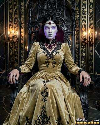 Pale woman in a gold dress sitting on a black throne