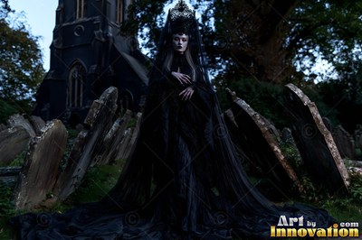 A woman in a long black veil stands among dark gravestones