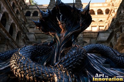 In an ancient stone courtyard, a part-snake woman rests within coiled black scales