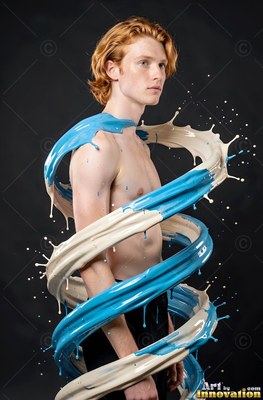 A shirtless redheaded man wrapped in a spiral splash of blue and white paint