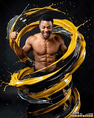 In a dark studio, a smiling shirtless man is encircled by thick yellow paint swirls