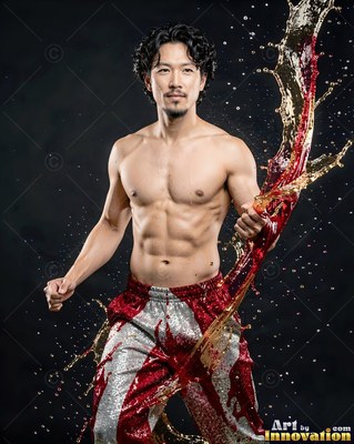 A shirtless man throwing a splash of red liquid