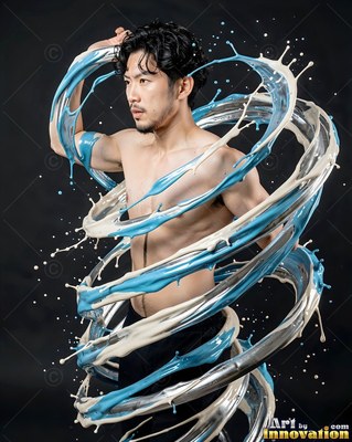 A shirtless man with dark hair turns in a black studio as blue and white paint spirals around him