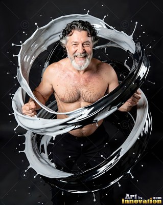 Smiling shirtless man encircled by swirls of black and white paint