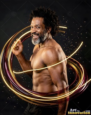 Smiling shirtless man surrounded by streaks of yellow and red light