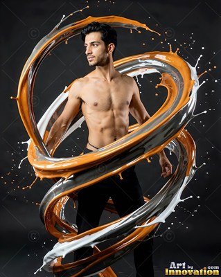 Standing bare-chested, a man is encircled by swirling ribbons of paint
