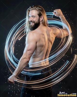 A shirtless bearded man flexing inside rings of white light trails