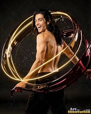 Long dark hair falls around a smiling shirtless man in a dark studio wrapped in bright swirls of liquid light