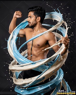 Turned in a dark studio, a shirtless man flexes inside swirls of white and blue liquid