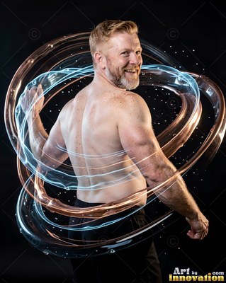 Shirtless smiling man surrounded by swirling light rings