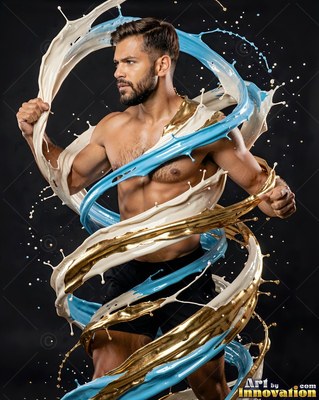 Standing in a dark studio, a shirtless man is wrapped in splashes of blue and gold paint