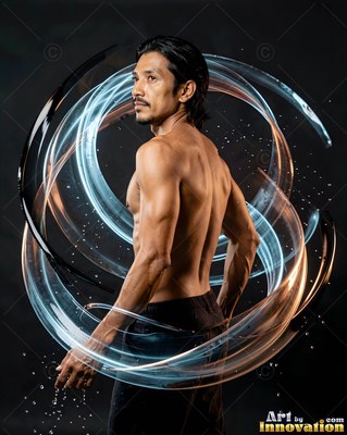 In a dark studio, a shirtless man turns beside swirling rings of blue light