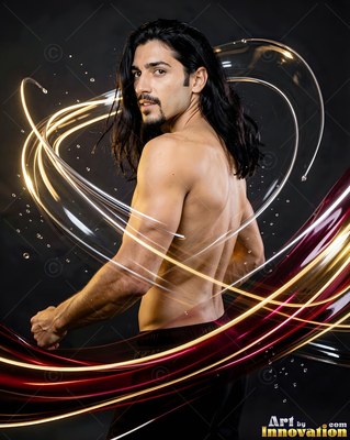 A shirtless man with long black hair turns around with streaks of light around him